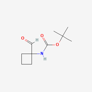 Struktura - tert-Butyl n-(1-formylcyclobutyl)carbamate, tert-Butyl (1-formylcyclobutyl)carbamate, additional blue/dry ice freight costs.